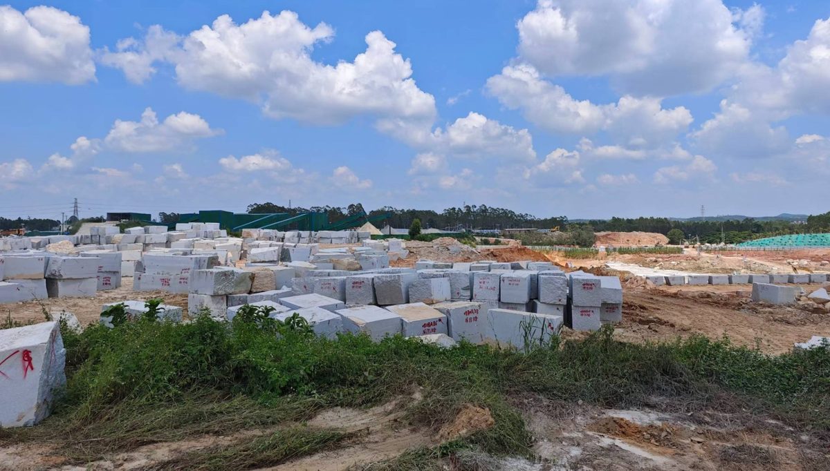 Granite blocks stacked in the open yard at the Lianjiang plant