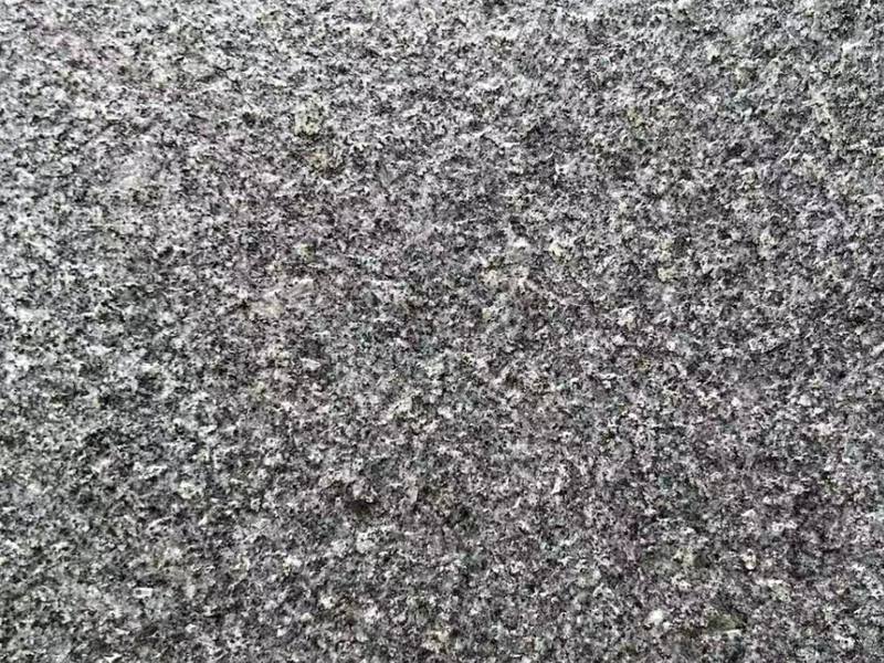 G654 Padang Dark granite, flamed finish, close-up of the grain at the Lianjiang plant